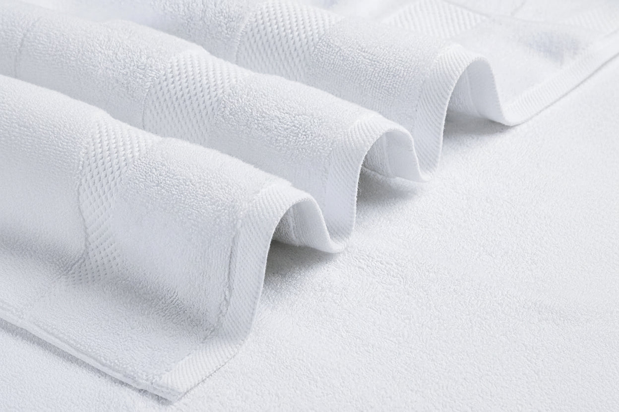 Close-up of white textured fabric on a white background